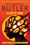 "Octavia E. Butler, Clay's Ark. A Patternist Novel. Kopf mit löchrigem Design vor welligem, gelbem Hintergrund.", Buch