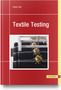 „Textile Testing“ von Dieter Veit. Rotes Cover, Bild von Maschinen mit Ketten und stacheligen Kugeln.
