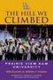 "The Hill We Climbed" in großen lila Buchstaben, darunter eine marschierende Band in uniformierten Outfits., Buch