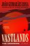 "JOÃO GUIMARÃES ROSA, translated by Alison Entrekin. Introduction by Colm Tóibín. Vastlands: The Crossing, A Novel." Eine rote, weite Landschaft mit Reiter.