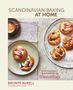 SCANDINAVIAN BAKING AT HOME. Brontë Aurell. Gebäckstücke auf Tellern und eine Tasse Kaffee auf einem Tuch.