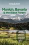 „Munich, Bavaria & the Black Forest“ und „Guide to Oktoberfest“ sind vermerkt. Eine idyllische Landschaft mit Bergen.