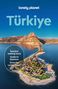 Text: "lonely planet", "Türkiye", "İstanbul walking tours", "Guide to Ephesus", "Drive the Lycian Coast". 
Luftaufnahme einer Landzunge mit Bergen im Hintergrund., Buch