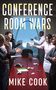 Text: "Conference Room Wars" und "Mike Cook". Menschen in Anzügen gestikulieren heftig in einem Konferenzraum., Buch
