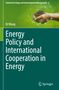 Oben: "Industrial Ecology and Environmental Management 6". Titel: "Energy Policy and International Cooperation in Energy". Name: Di Wang. Hands mit Erde und Pflänzchen., Buch