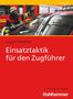 Text: "Führung", "Jürgen Wohlrab", "Einsatztaktik für den Zugführer", "3., erweiterte Auflage", "Kohlhammer". Feuerwehrmann zeigt.