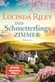 Text: "Lucinda Riley Das Schmetterlingszimmer Roman, SPIEGEL Bestseller Platz 1, Goldmann." Ein Landhaus vor grünen Hügeln und blühenden Bäumen., Buch