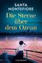 „Santa Montefiore: Die Sterne über dem Ozean. Roman. Goldmann.“ Frau auf einem Schiff, mit Blick auf den nächtlichen Himmel.