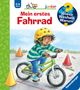 Text: "2-4 Jahre", "junior", "Mein erstes Fahrrad", "Wieso Weshalb Warum". Illustration: Kind mit gelbem Helm auf grünem Fahrrad., Buch