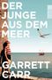 "DER JUNGE AUS DEM MEER", "GARRETT CARR", "ROMAN". Ein Junge steht an einer Felswand, nahe am Meer, eine Möwe fliegt., Buch