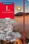 Reiseführer "BAEDEKER LANZAROTE" mit Strandmotiv, Meer im Vordergrund, Berge im Hintergrund.