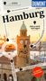 Titel: "Hamburg"
Text: "auf 4000 Eichenpfählen gebaut", "falls es doch mal regnet", "Fernweh", "Mit großem Cityplan"
Bild vom Hamburger Hafen mit Uhrturm., Buch