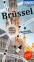 „Brüssel“ in großer Schrift. „Flanieren unterm Glasdach“, „Mit großem Cityplan“. Architektur mit Türmen im Hintergrund., Buch