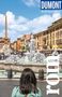 Text: "DUMONT Reise-Taschenbuch", "rom". Eine Frau betrachtet einen belebten Platz mit einem Brunnen und einem Obelisken., Buch