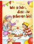 Bunte Schrift: "Wie schön, dass du geboren bist." Kinder und Hund feiern um einen Kuchen mit Kerze. Fröhliche Stimmung., Buch