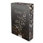 Buchtitel: "Things That Break Us" von Michelle Heard. Cover zeigt weiße Vögel auf dunklem Hintergrund., Buch