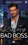 Text: "HAILEY J. ROMANCE", "Kiss my BAD BOSS". Ein Mann im Anzug vor einer nächtlichen Skyline., Buch