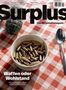 „Surplus – Das Wirtschaftsmagazin. Waffen oder Wohlstand“. Eine Schale voller Patronen auf kariertem Tuch., Buch