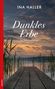 "Dunkles Erbe. Kriminalroman. Ina Haller." Ein Steg führt zu einem See bei Sonnenuntergang, umgeben von Schilf., Buch