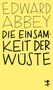 Der Text in schwarzen Buchstaben lautet: "EDWARD ABBEY DIE EINSAMKEIT DER WÜSTE". Unten rechts ist eine kleine, stilisierte Figur., Buch