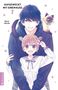 "AUFGEWECKT MIT EINEM KUSS 7" steht über einem Manga-Pärchen, ein Mädchen lächelt, Junge mit Katze auf der Schulter., Buch