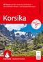 "Korsika. 88 Touren auf der »Insel der Schönheit«. Mit ROTHER APP." zeigt bergige Landschaft mit Bäumen., Buch