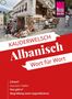 KAUDERWELSCH Albanisch Wort für Wort. Ç'kemi? was (wir-) haben. Was gibt's? (Begrüßung unter Jugendlichen). Kopfsteinpflasterstraße mit Souvenirständen., Buch