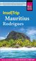 "Insel|Trip Mauritius Rodrigues" steht auf einem Reiseführer mit Strand, Palmen und einem Berg im Hintergrund., Buch