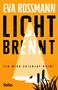 Titel: "Licht brennt". Autor: Eva Rossmann. Ein Krimi. Darstellung: Gelber Hintergrund, Schilf und ein Boot im Lichtkegel., Buch