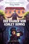 Der Titel "Der Räuber von Ashley Downs" steht groß in der Mitte. Ein Mann mit Bart streckt die Arme vor einem Gebäude aus., Buch