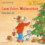 Conni feiert Weihnachten und fährt Ski. Ein Mädchen mit rotem Pullover schmückt einen Weihnachtsbaum. Katze daneben., CD
