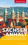 "Trescher Verlag, MEHR WISSEN. BESSER REISEN. SACHSEN-ANHALT, Mit Magdeburg ... Naumburg und Ostharz. Heinzgeorg Oette."  
Im Hintergrund sind historische Gebäude mit hohen Türmen, eingebettet in eine hügelige Landschaft, zu sehen., Buch