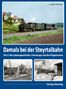 Damals bei der Steyrtalbahn. Historische Lokomotive fährt durch ländliche Gegend. Oben links Häuser, unten Schneeszene., Buch