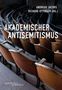 „Andreas Jacobs. Richard Ottinger (Hg.). Akademischer Antisemitismus.“ Holzstühle in einem Vortragssaal., Buch