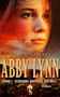 Der Text zeigt: "Rainer M. Schröder, Abby Lynn, Band 1, Verbannt ans Ende der Welt, Roman". Im Hintergrund das Gesicht einer Frau., Buch