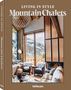 "LIVING IN STYLE Mountain Chalets" in Beige, zeigt ein stilvolles Chalet-Interieur mit Kamin, Fellmöbeln und Bergblick.