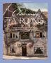 Text: "Charming Tea Rooms", "From Great Britain to the World", "Teehäuser & Cafés weltweit". Altes Steinhaus mit Blumen., Buch