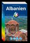 Titel „Albanien“ von Ralph-Raymond Braun. Im Hintergrund eine alte Kirche mit roten Ziegeldächern., Buch