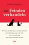 Text: "Adam Kahane - Mit Feinden verhandeln". Silhouetten von einem Hund und einer Katze gegenüber auf rotem Hintergrund.