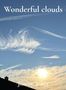 "Wonderful clouds" und "Jimmy Jones". Himmel mit leichten Wolkenstreifen und strahlender Sonne über einem Dach., Buch