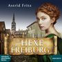 Text: "Astrid Fritz", "Die Hexe von Freiburg", "steinbach sprechende bücher", "AUDIOBUCH". Eine Frau in historischer Kleidung., 2 MP3-CDs