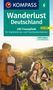 Titel: "Wanderlust Deutschland". Drei Personen wandern bei Sonnenschein in einer grünen, hügeligen Landschaft., Buch