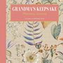 Text in der Mitte: "GRANDMA'S MEMORIES for MY GRANDCHILD: A Journal and Keepsake". Illustration: Blumenkranz auf gelbem Muster., Buch