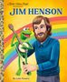 Text: "a Little Golden Book Biography. JIM HENSON. By Luke Flowers."  
Illustration: Ein Mann mit einem grünen Frosch und Regenbogen., Buch