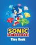 "Sonic The Hedgehog Tiny Book" in gelbem und weißem Text. Illustration von Sonic, umgeben von bunten Edelsteinen.