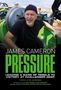 JAMES CAMERON PRESSURE; Mann in schwarzem Shirt und Mütze lacht in einer technischen Umgebung.