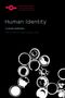"Human Identity", Claude Romano. Schwarzer Hintergrund, weiße Kreise unten, links oben rotes Logo., Buch