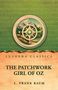 Texte: "Lushena Classics", "The Patchwork Girl of Oz", "L. Frank Baum". Eine Landschaft in einem dekorativen Kreis., Buch