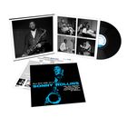 "Blue Note 1558 Vol. 2 SONNY ROLLINS" steht in blauer Schrift. Jazzmusiker mit Saxophon, Schallplatte, und schwarz-weiße Fotos.