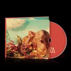 Cover mit "LOVZA" an der Seite. Frau in gelber Bluse, isst Frucht, umgeben von Blumen und Früchten.